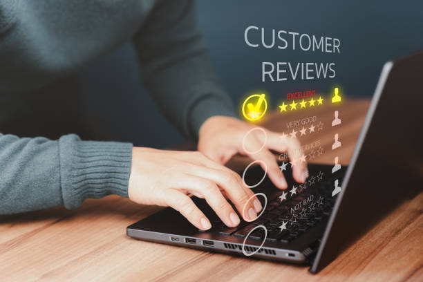 istock Businessman hand using computer laptop with popup five star icon for feedback review satisfaction service, testimonial. Customer service experience and business satisfaction survey. 1481799935
