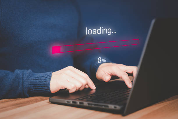 istock Adult man using a laptop computer for download software and waiting to loading digital business data form website, very slow internet form wifi. Concept of waiting for load of loading symbol. 1481799937