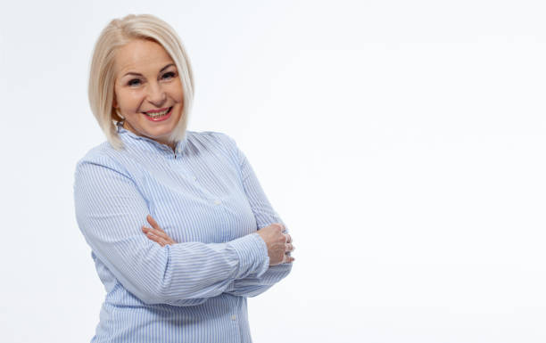 istock Attractive middle aged woman with folded arms on white background 1481802422
