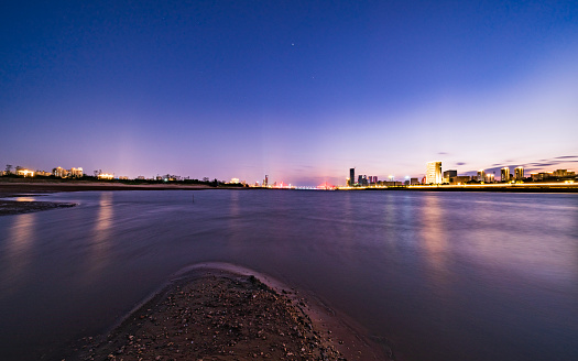 Dry river, modern city night scene