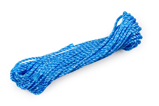 Blue rope on a white background. A coil of clothesline on a white background.