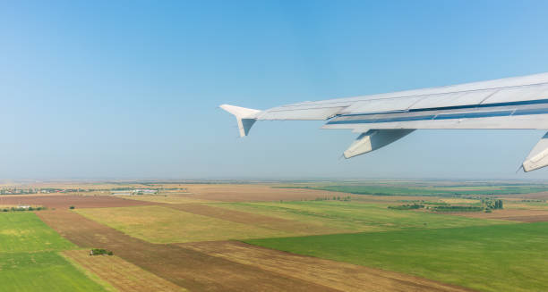 istock View from the airplane window during taking off on a clear summer morning 1481816578