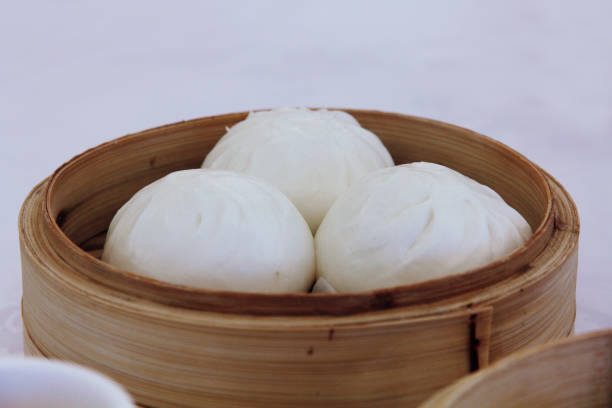 istock Steamed bun. It is a Chinese snack or appetizer. Packed in bamboo baskets, Close up 1481817443