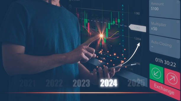 Businessman or trader is using smartphone and virtual hologram stock, invest in trading, planning analyze indicator and strategy for year 2024 buy and sell, Stock market, Business growth, progress or success concept. el empresario o comerciante está utilizando el teléfono inteligente y el holograma virtual de acciones, invertir en el comercio, planificar el indicador de análisis y la estrategia para el año 2024 comprar y vender, mercado de valores, crecimiento empr