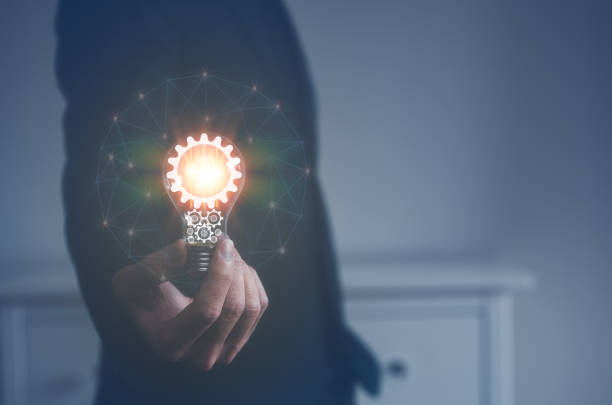 istock idea and creativity concept. Hand of businessman holding illuminated light bulb with network connection line, idea, innovation and inspiration concept 1481819202