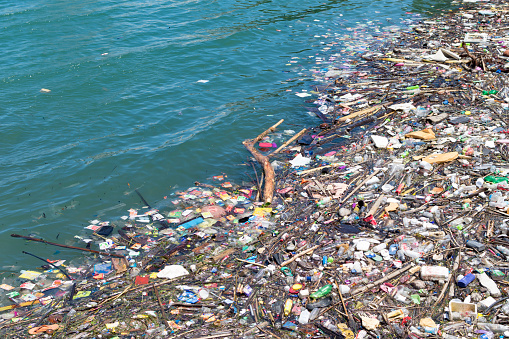 Lots of plastic and other debris in the sea. Ecological catastrophy. High quality photo
