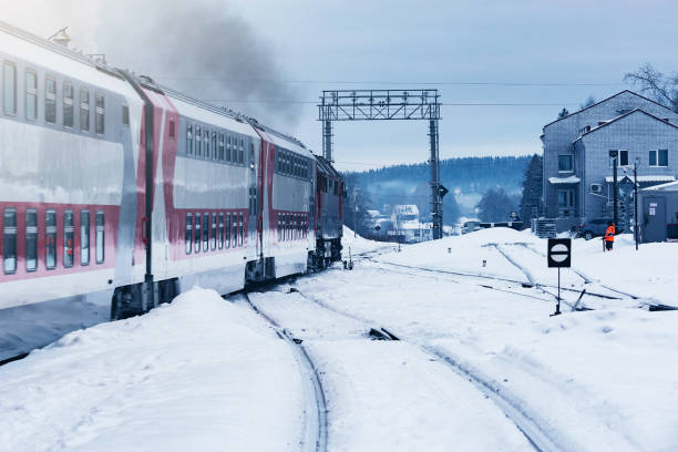 istock Passenger train departs from the station at winter morning. 1481820175