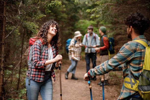 istock Happy hikers talking on a break in forest. 1481829031