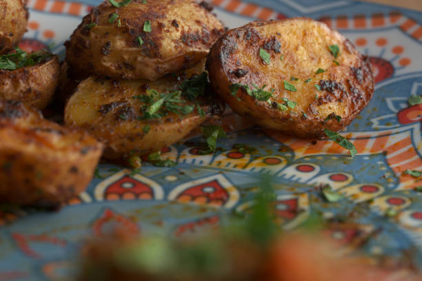 istock Uzbek food, roasted potatoes with herbs 1481830833