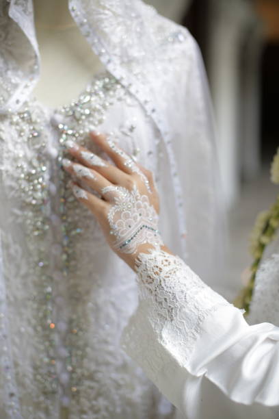 istock the bride's hands are decorated with white henna which is very beautiful 1481832042