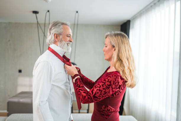 istock Tying A Necktie With Help Of A Woman 1481834327