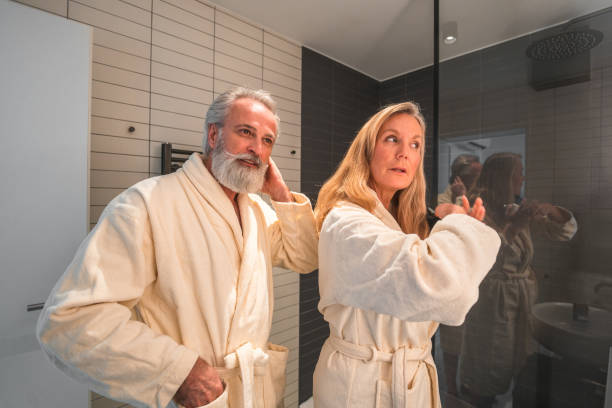 istock Mature Caucasian Couple Getting Ready In A Domestic Bathroom 1481834478