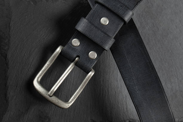 istock Black leather belt on a dark background. Leather products. 1481835253
