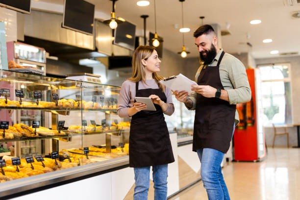 istock Mid audlt  startup partners taking online orders, pastry, and bakery food shop 1481836634