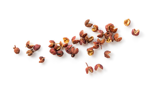 Sichuan pepper placed on a white background. View from above.