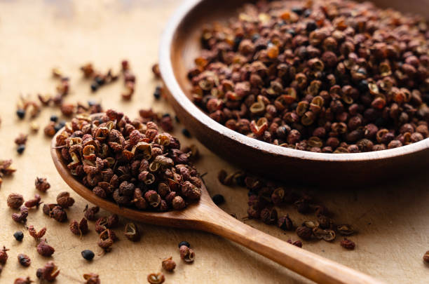 istock Sichuan pepper and wooden spoon on the table. 1481837442