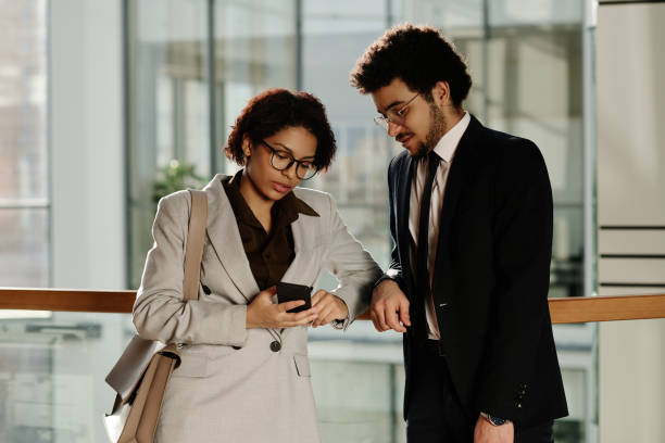 istock Business colleagues discussing message on smartphone 1481837757