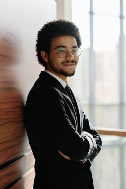istock Young businessman in black suit 1481837831