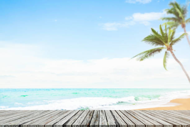 istock Table on Sea Summer Background,Desk on Sand Beach and Ocean at Coast with Palm Tree and Deck White Cloud Blue Sky Sunny nature,Wooden with Shore Horizon Tropical,Tourism Vacation Resort Travel 1481837941