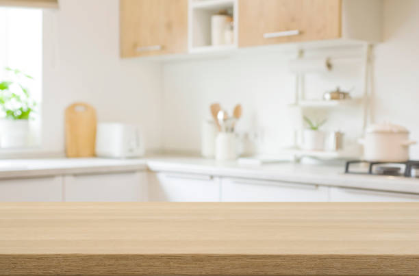 istock Kitchen table top for product disply with blurred modern interior 1481839003