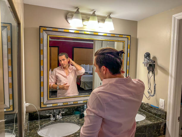istock Thirty-something Brazilian man gelling hair 1481839936
