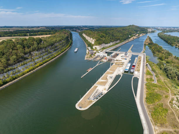 Freight ships in the Lanaye locks where the Albert Canal connects to the river Meuse close to Liege and Maastricht. Drone point of view.