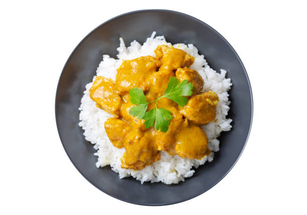 istock plate of chicken with curry sauce and rice isolated on white background 1481843662