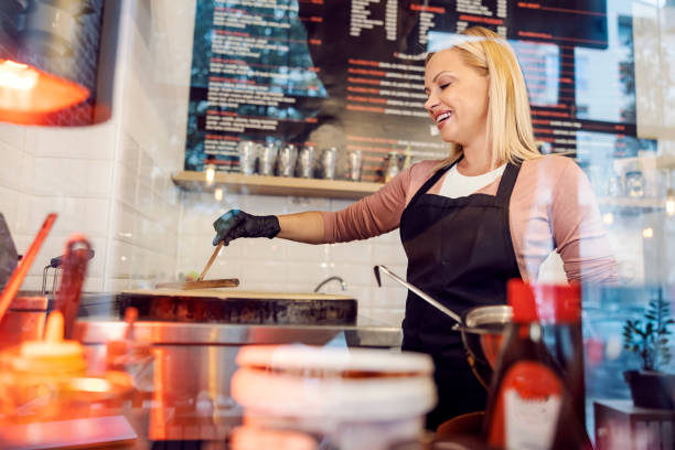 istock A happy pancake shop chef is baking crapes on hot plate in kitchen. 1481846066