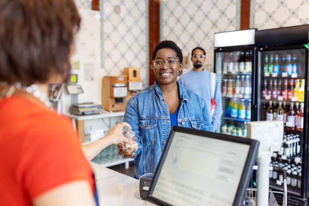 istock Cashier attending customers at zero waste store 1481847480