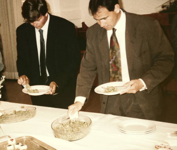 istock Handsome men having fun at dinner party in 1968. 1481849282
