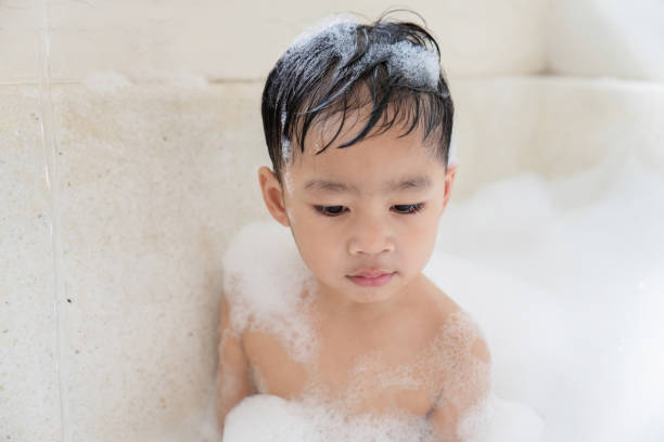 istock boy taking a bath in the tub take bath he plays with bubbles 1481849613