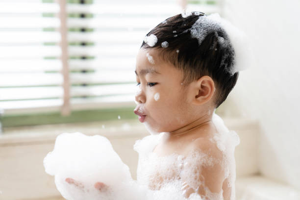 istock boy taking a bath in the tub take bath he plays with bubbles 1481849645