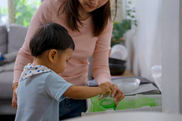 istock Woman teach son to garbage. 1481849912