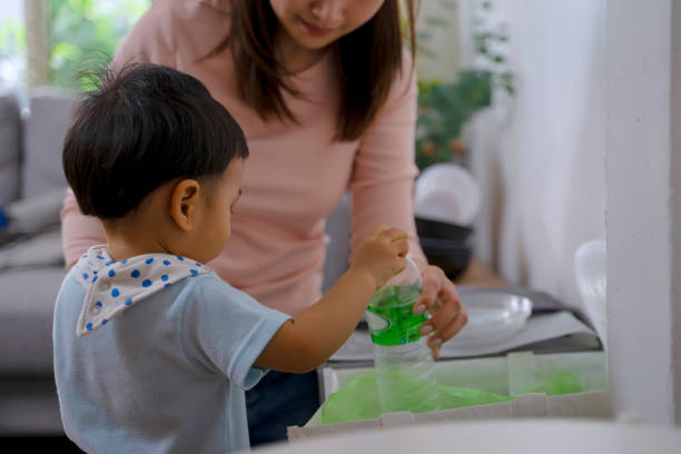 istock Woman teach son to garbage. 1481849921