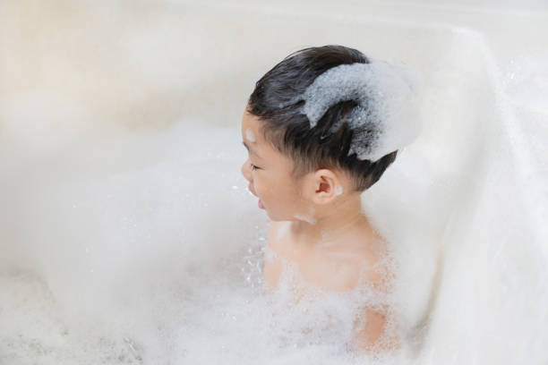 istock boy taking a bath in the tub take bath he plays with bubbles 1481849976