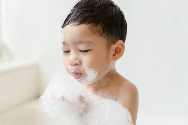 istock boy taking a bath in the tub take bath he plays with bubbles 1481850029