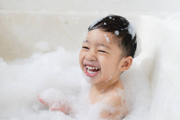 istock boy taking a bath in the tub take bath he plays with bubbles 1481850057
