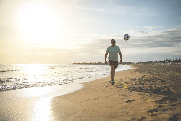 istock man walking and doing sports on the beach 1481850139