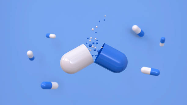 istock Large open white and blue pill with medicine leaking from it over a blue background. Concept of medicine, research and science. 3d rendering. 1481850695