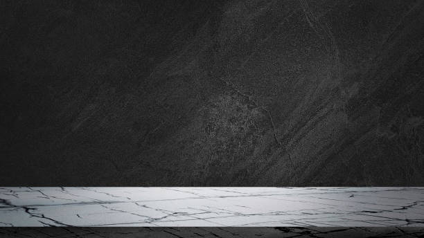 istock empty white carrara marble tabletop on dark black cement stone background for product displayed in rustic mood and tone. luxury background for product stand with empty copy space for advertisation. 1481850725