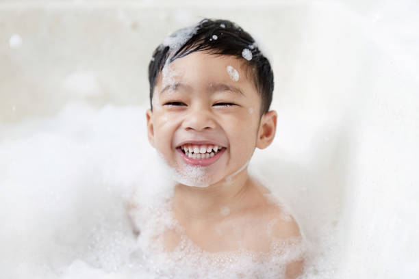 istock boy taking a bath in the tub take bath he plays with bubbles 1481850889