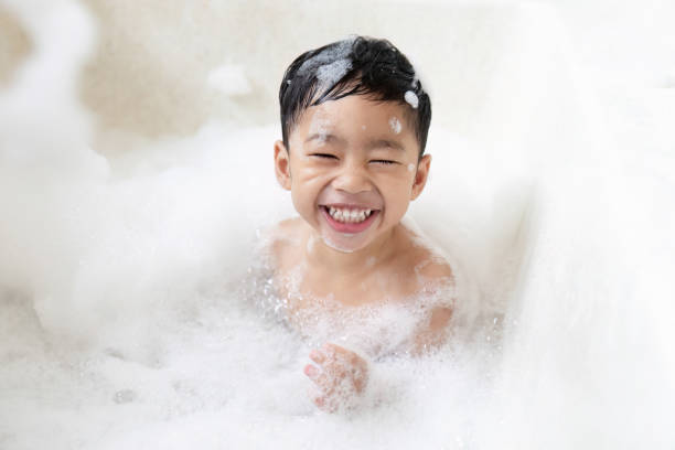 istock boy taking a bath in the tub take bath he plays with bubbles 1481851057