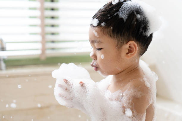 istock boy taking a bath in the tub take bath he plays with bubbles 1481851131