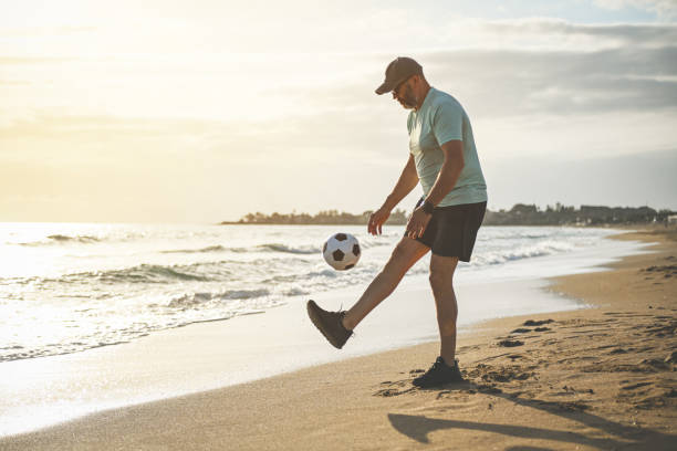 istock man walking and doing sports on the beach 1481852313