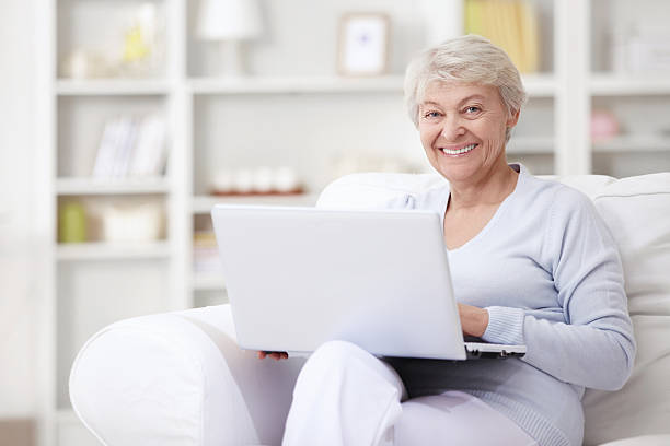 istock An elderly woman with a laptop 148185237