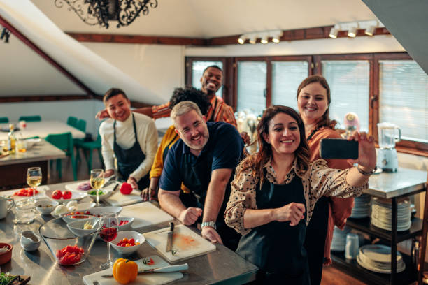 istock Cheerful friends take selfie with chef. 1481857884