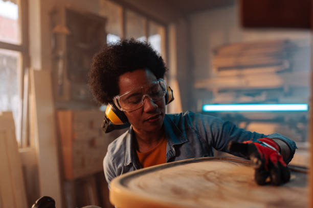 istock Woman refurbishing chair in workshop. 1481858224