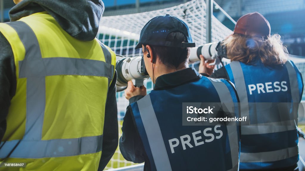 Professional Press Officer, Sports Photographers with Camera Zoom Lens Shooting Football Championship Match on Stadium. International Cup, World Tournament Event. Photography, Journalism, Media Journalist Stock Photo