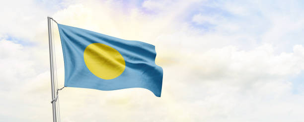istock Palau flag waving on sky background. 3D Rendering 1481859409