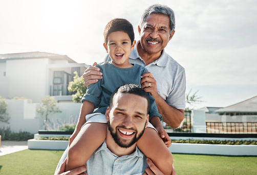 Portrait of happy family child, father and grandfather bonding, smile or enjoy quality time together in front yard. House lawn, vacation love and outdoor people on holiday in Rio de Janeiro Brazil